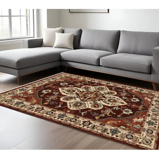 Red Ivory Orange And Blue Oriental Power Loom Stain Resistant Area Rug With Fringe Photo 1