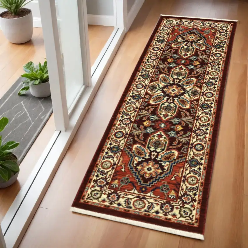 2' X 6' Red Ivory Orange And Blue Oriental Power Loom Stain Resistant Runner Rug With Fringe Photo 1