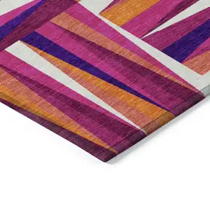 Photo of Red Purple And Copper Geometric Washable Indoor Outdoor Area Rug
