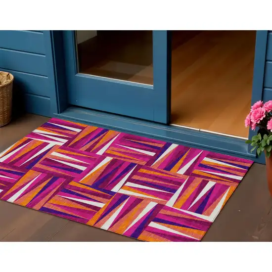 Red Purple And Copper Geometric Washable Indoor Outdoor Area Rug Photo 1