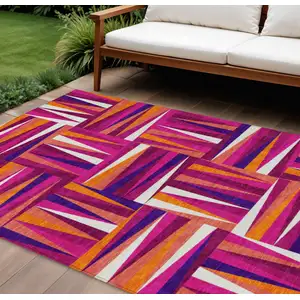 Photo of Red Purple And Copper Geometric Washable Indoor Outdoor Area Rug