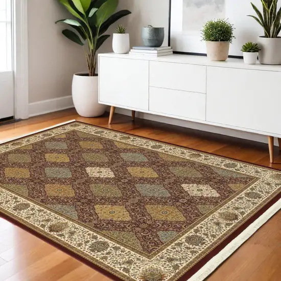 Red Tan And Ivory Oriental Area Rug With Fringe Photo 1
