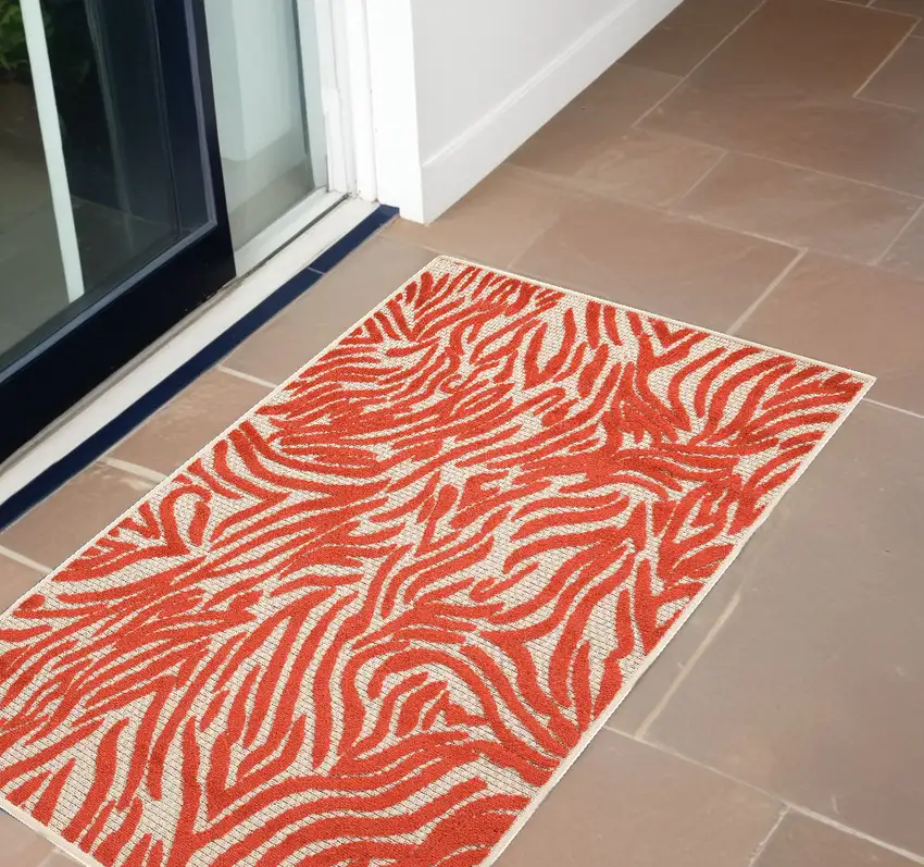 Red And Ivory Abstract Indoor Outdoor Area Rug Photo 1