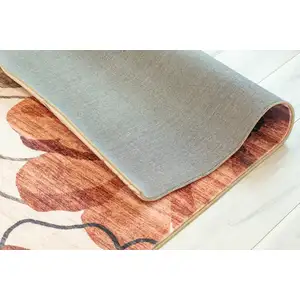 Photo of Red and Beige Floral Distressed Area Rug
