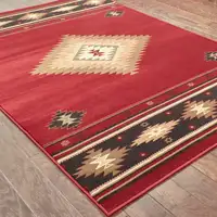 Photo of Red and Beige Ikat Pattern Area Rug
