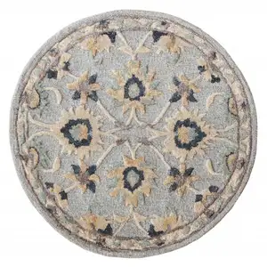 Photo of Round Blue and Beige Floral Area Rug