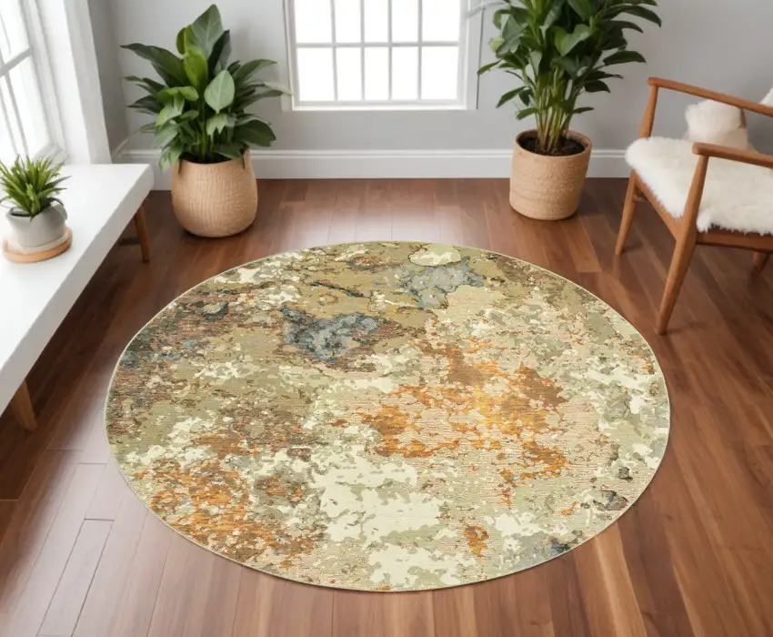 8' Gold and Ivory Round Power Loom Area Rug Photo 1