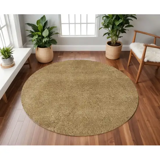 8' Gold Hand Woven Round Rug Photo 1