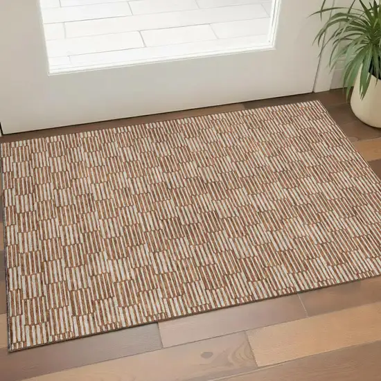 Rust And Beige Abstract Geometric Washable Area Rug With UV Protection Photo 1