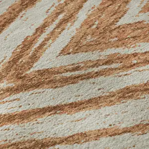 Photo of Rust And Beige Abstract Washable Area Rug With UV Protection