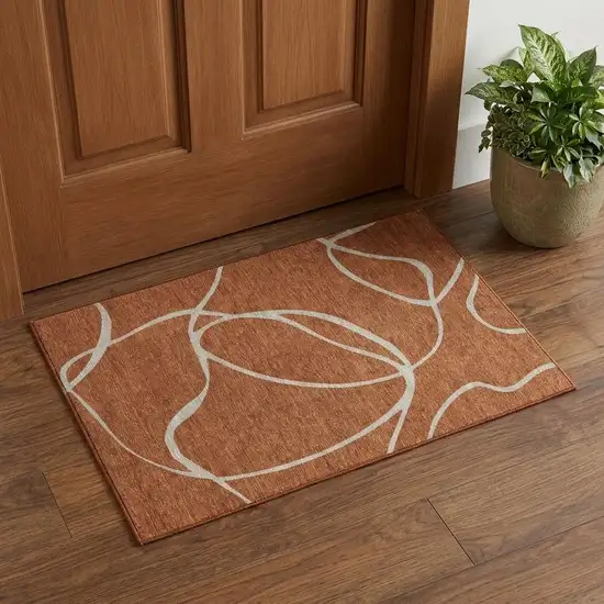 Rust And Beige Abstract Washable Area Rug With UV Protection Photo 1
