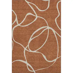 Photo of Rust And Beige Abstract Washable Area Rug With UV Protection