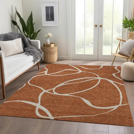 Rust And Beige Abstract Washable Area Rug With UV Protection Photo 5