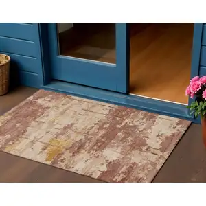 Photo of Rust And Beige Abstract Washable Indoor Outdoor Area Rug