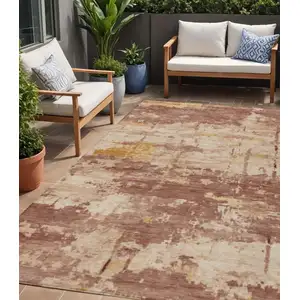 Photo of Rust And Beige Abstract Washable Indoor Outdoor Area Rug