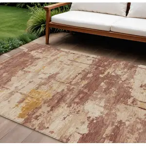 Photo of Rust And Beige Abstract Washable Indoor Outdoor Area Rug