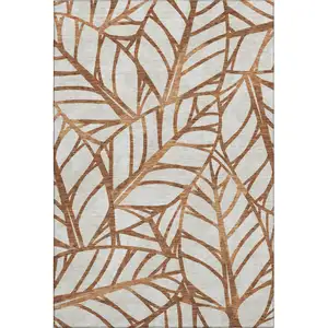 Photo of Rust And Beige Floral Washable Area Rug With UV Protection