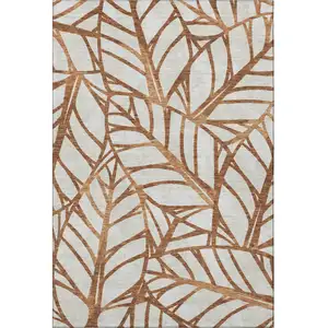 Photo of Rust And Beige Floral Washable Area Rug With UV Protection