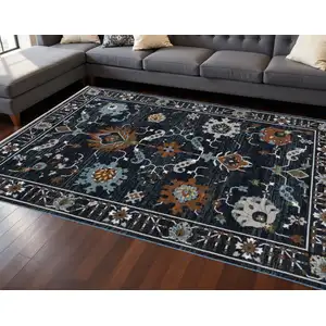 Photo of Rust And Black Oriental Area Rug With Fringe