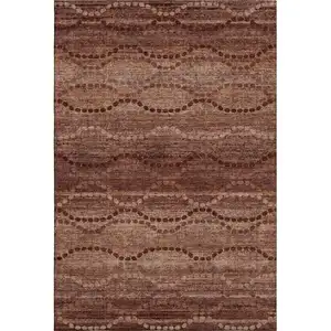 Photo of Rust And Copper Abstract Geometric Washable Area Rug With UV Protection