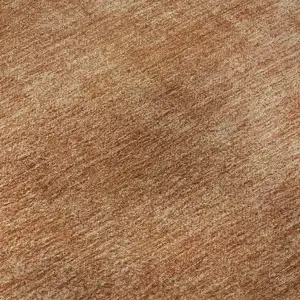 Photo of Rust And Copper Abstract Washable Area Rug With UV Protection
