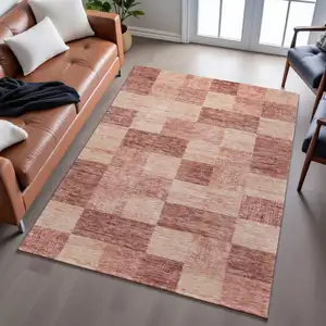 Photo of Rust And Copper Geometric Washable Area Rug With UV Protection