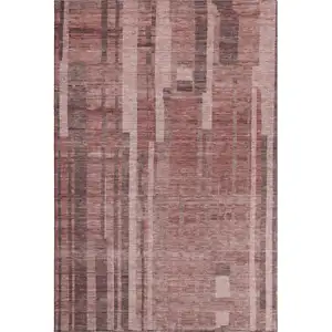 Photo of Rust And Coral Striped Washable Area Rug With UV Protection