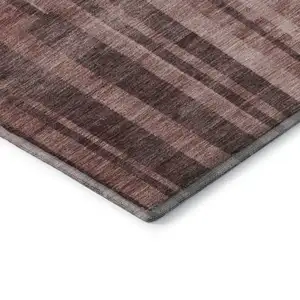 Photo of Rust And Coral Striped Washable Area Rug With UV Protection