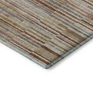 Photo of Rust And Gray Striped Washable Area Rug With UV Protection