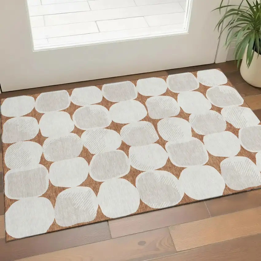 Rust And Ivory Abstract Geometric Washable Area Rug With UV Protection Photo 1