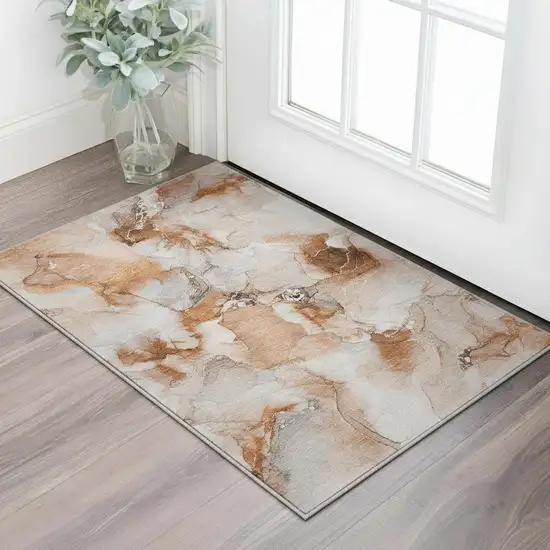 Rust And Ivory Abstract Washable Area Rug With UV Protection Photo 1