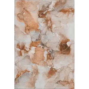 Photo of Rust And Ivory Abstract Washable Area Rug With UV Protection
