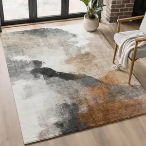 Photo of Rust And Ivory Abstract Washable Area Rug With UV Protection