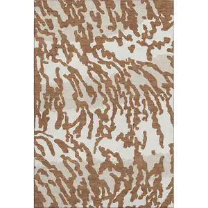 Photo of Rust And Ivory Animal Print Washable Area Rug With UV Protection