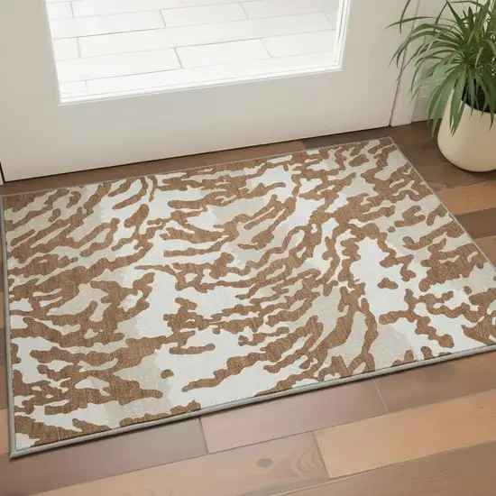 Rust And Ivory Animal Print Washable Area Rug With UV Protection Photo 2