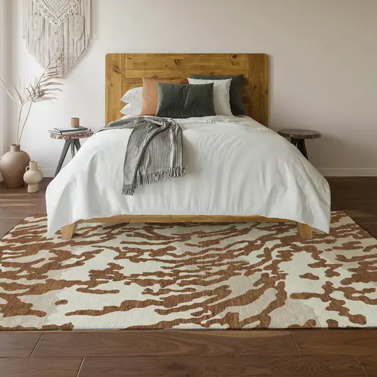 Rust And Ivory Animal Print Washable Area Rug With UV Protection Photo 6