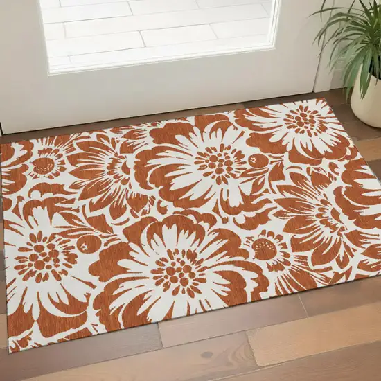 Rust And Ivory Floral Washable Area Rug With UV Protection Photo 1