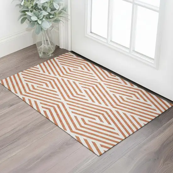 Rust And Ivory Geometric Washable Area Rug With UV Protection Photo 1