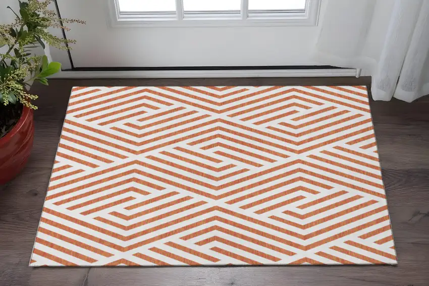 Rust And Ivory Geometric Washable Area Rug With UV Protection Photo 2