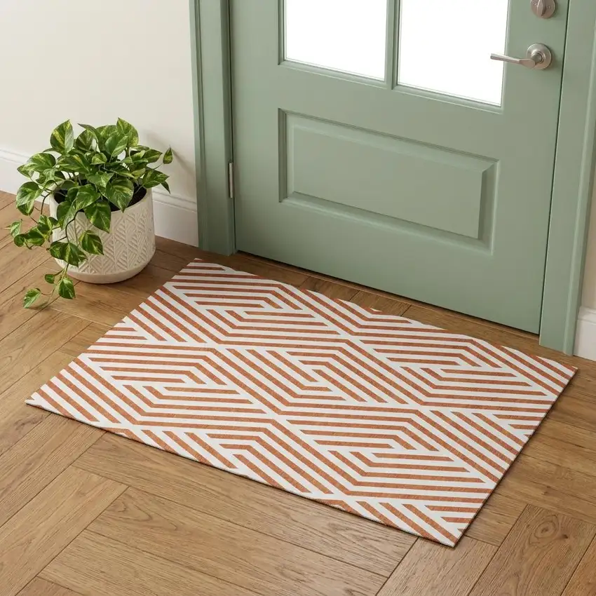 Rust And Ivory Geometric Washable Area Rug With UV Protection Photo 1