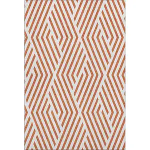 Photo of Rust And Ivory Geometric Washable Area Rug With UV Protection