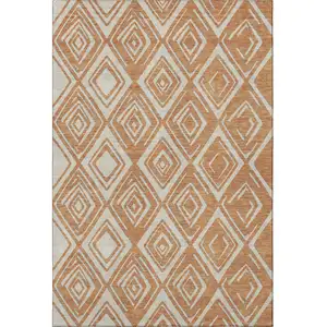 Photo of Rust And Ivory Geometric Washable Area Rug With UV Protection