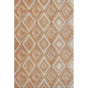 Photo of Rust And Ivory Geometric Washable Area Rug With UV Protection