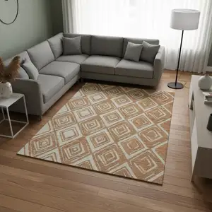 Photo of Rust And Ivory Geometric Washable Area Rug With UV Protection