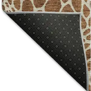 Photo of Rust And Ivory Geometric Washable Area Rug With UV Protection