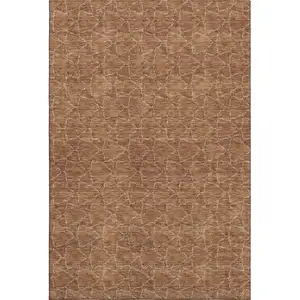 Photo of Rust And Ivory Geometric Washable Area Rug With UV Protection