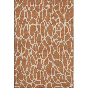 Photo of Rust And Ivory Geometric Washable Area Rug With UV Protection
