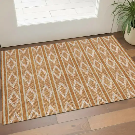 Rust And Ivory Geometric Washable Area Rug With UV Protection Photo 1