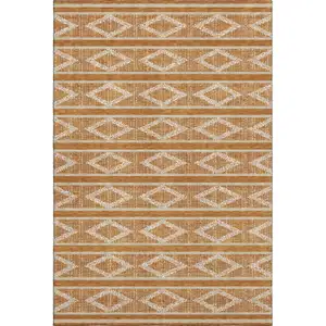 Photo of Rust And Ivory Geometric Washable Area Rug With UV Protection