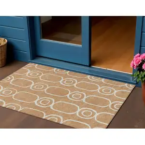 Photo of Rust And Ivory Geometric Washable Indoor Outdoor Area Rug